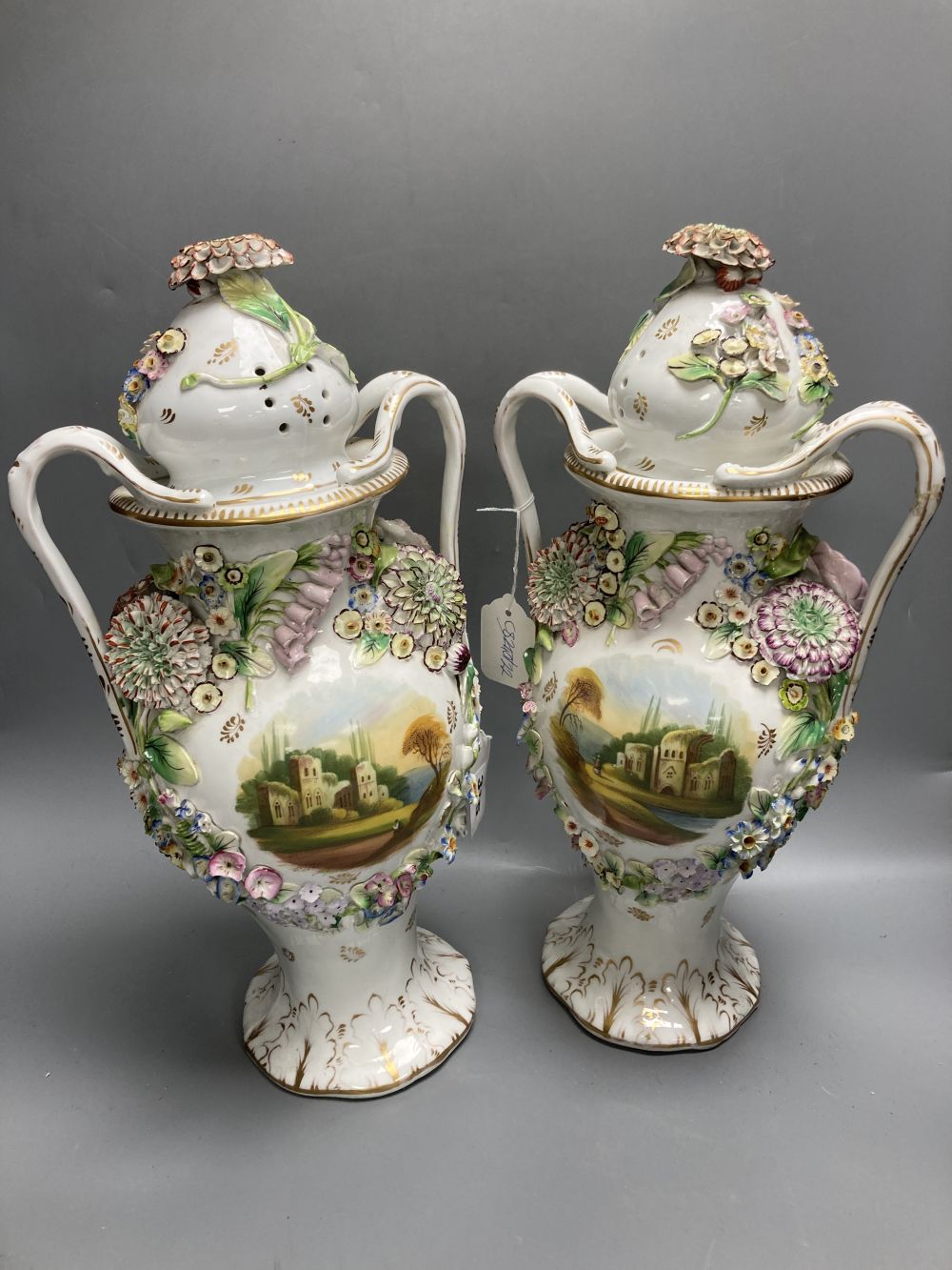 A pair of Coalbrookdale style lidded vases, overall height 43cm